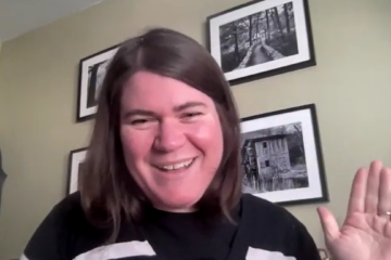 Photo of Dr. Stephanie Meredith, a white woman with brown hair, waving hello.